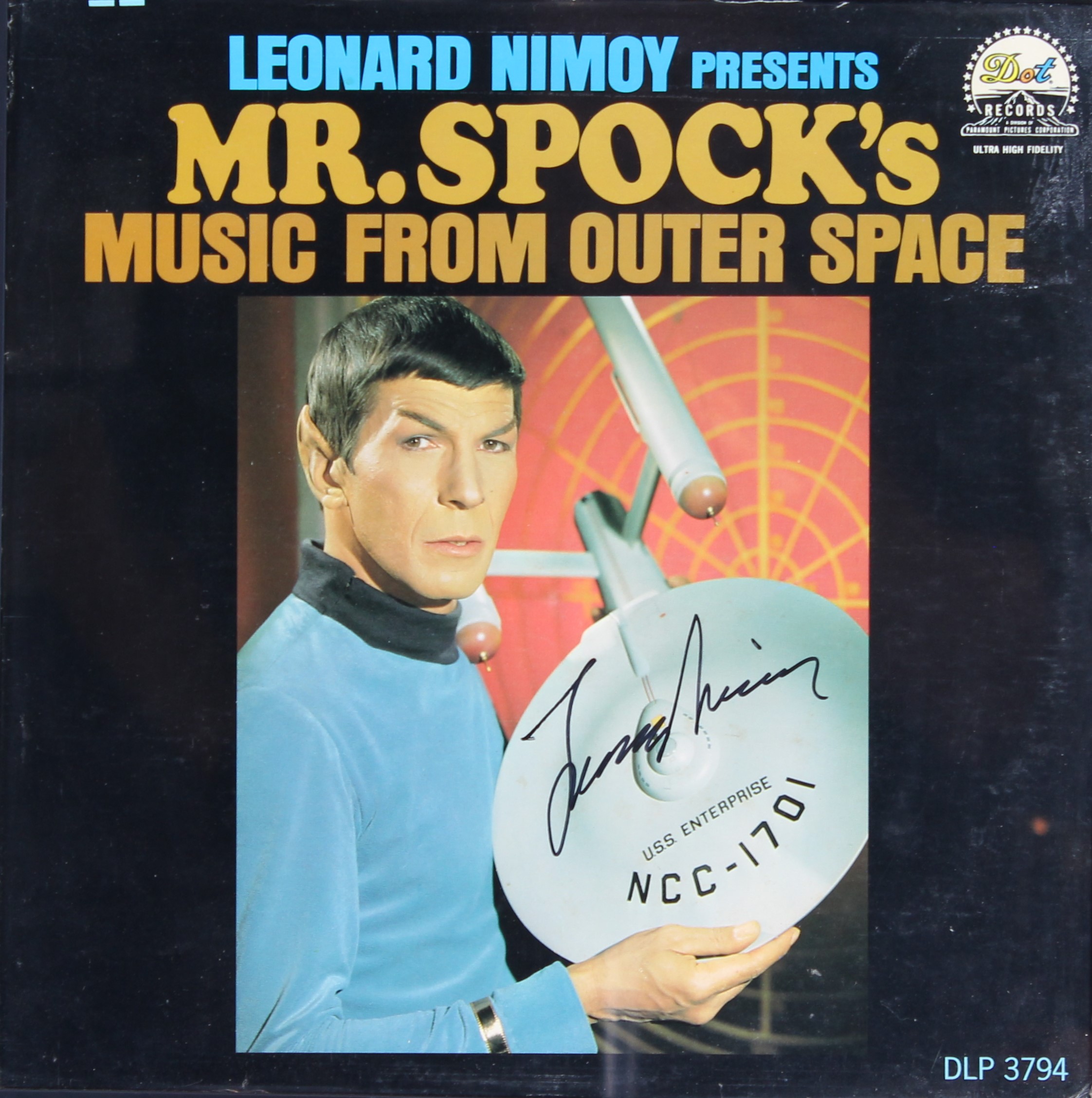The cover of the LP record Mr. Spock's Music from Outer Space, showing Spock holding the three-foot model of the Enterprise. It is signed by Leonard Nimoy.