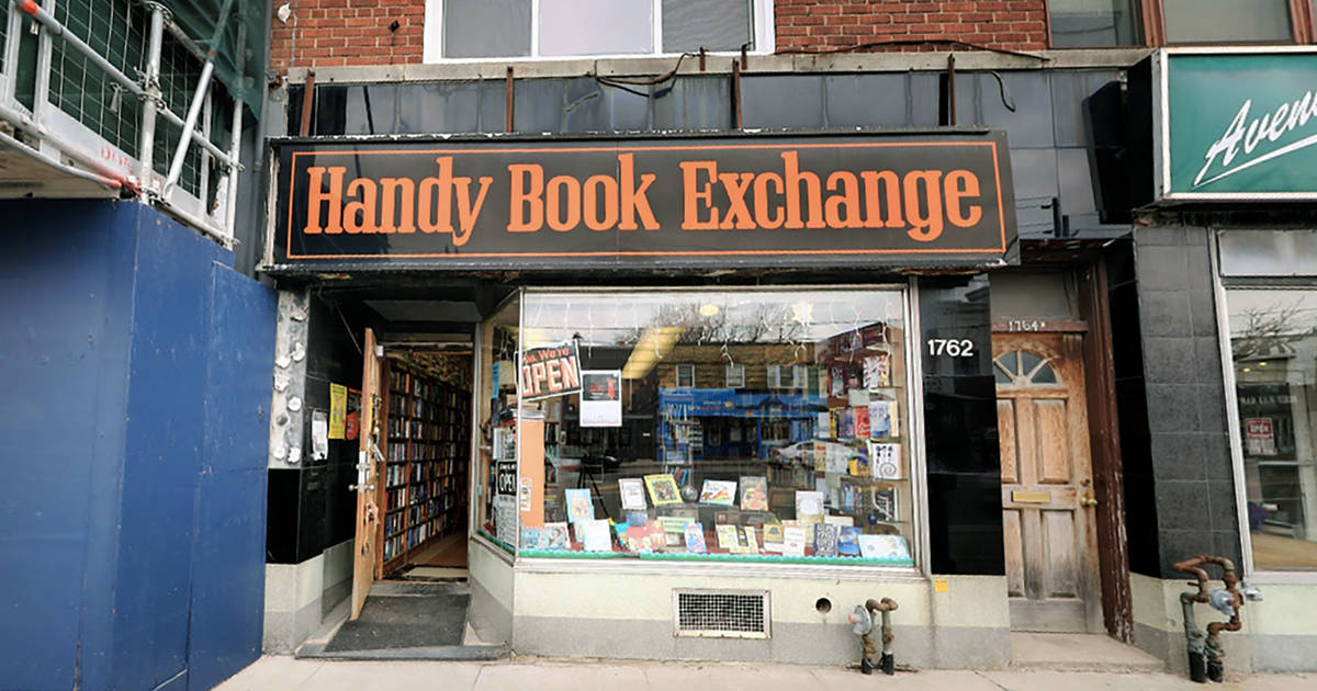 A photo of the outside of the Handy Book Exchange in Toronto, showing some renovation work being done beside the store 