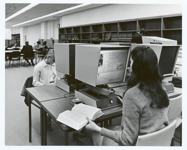 An image from the Internet of people using microfilm readers in the '80s.
