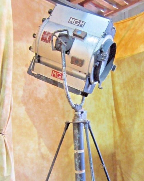A vintage studio light on a stand.