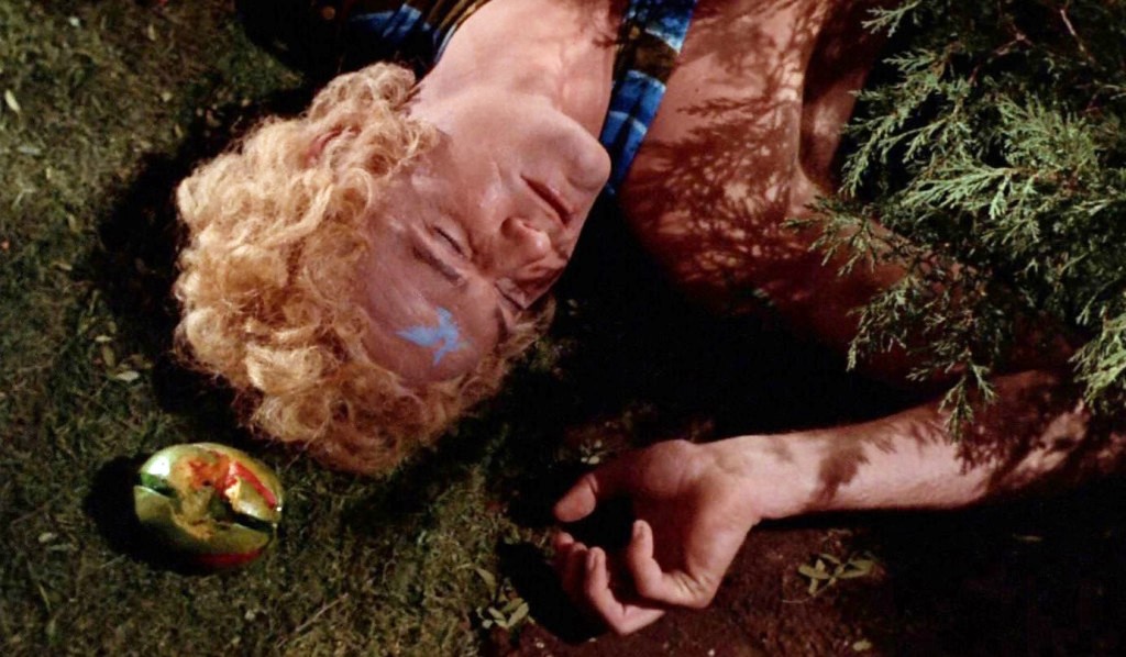 A screencap from The Way to Eden, showing Adam dead on the ground.
