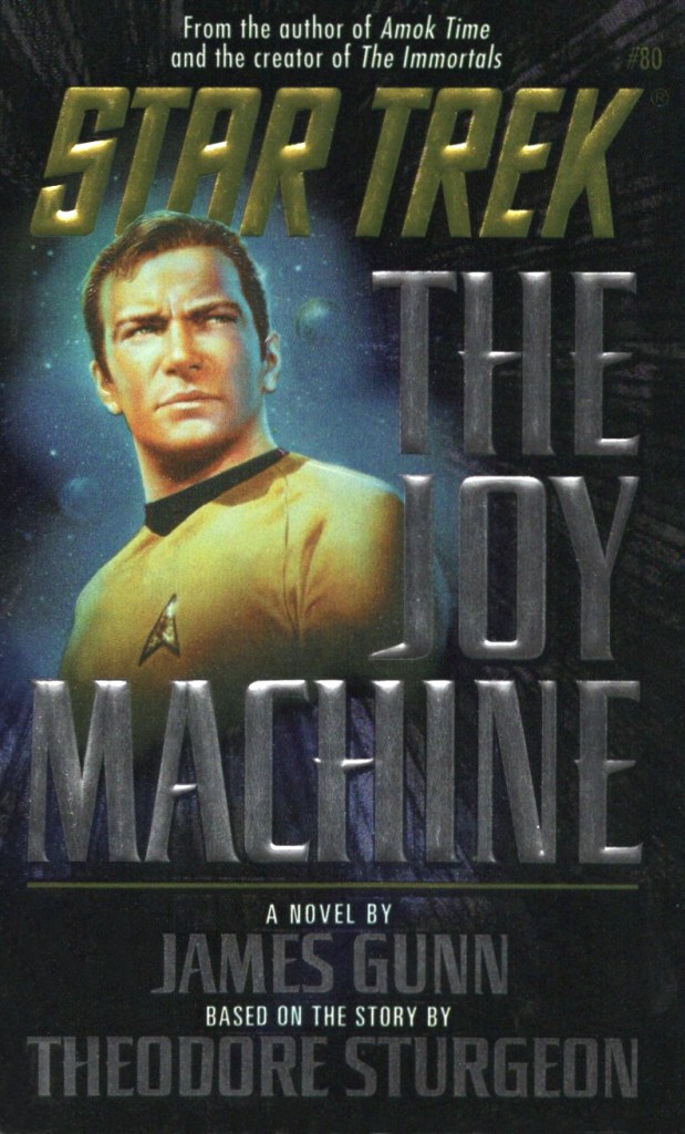 The cover of The Joy Machine novel, showing Kirk looking resolute.
