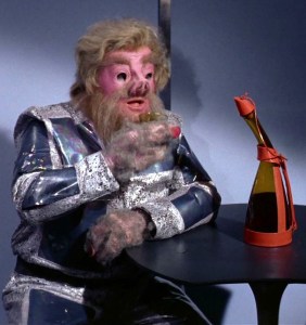 An screen cap from the Star Trek episode Journey to Babel, showing a Tellarite with an oddly shaped bottle, which was actually a real-world whiskey bottle made by Dickel. 