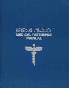 The cover of the Medical Reference Manual. It is a deep blue with lettering and a caduceus in silver. 